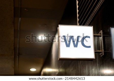 WC sign in underground in subway station