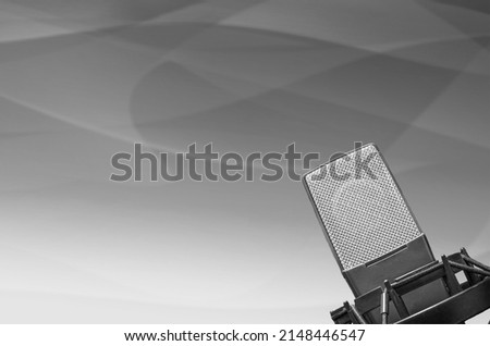 Professional microphone in radio station studio background
