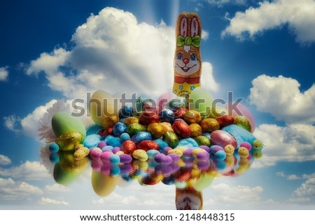 Easter eggs stacked together on Holiday with a beautiful cloudy background with chocolates to celebrate and enjoy family time