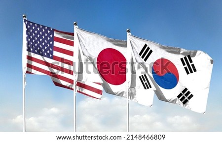 American flag with blue sky and Japanese flag with South Korean flag. waving blue sky