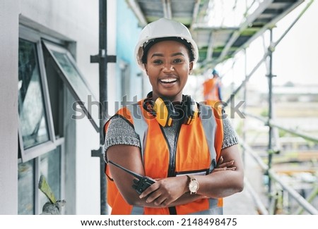 Youll want to invest in this new development. Portrait of a young woman working at a construction site. Royalty-Free Stock Photo #2148498475