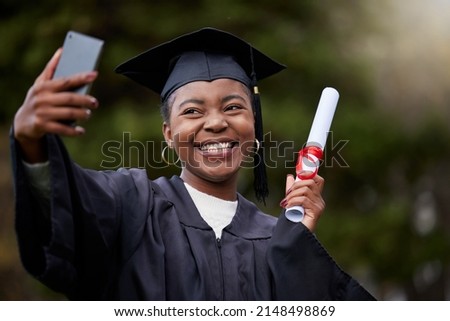 Everyone will be so proud of me. Shot of a young woman taking selfies on graduation day.