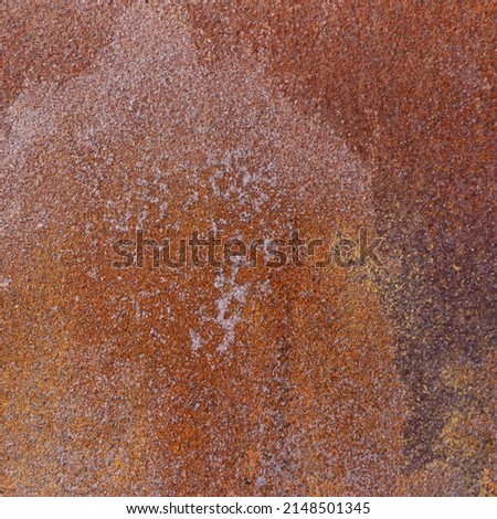 Texture of a rusty metal door. Old sheet of iron for the background. The iron is covered in rust.