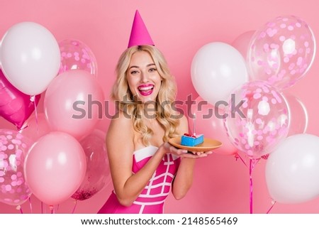 Photo of funny lady hold cake piece dish have birthday fun wear cone hat fancy striped dress isolated pink color background