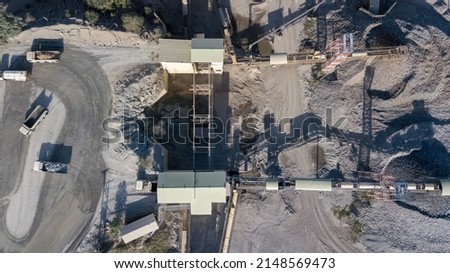 Aerial view cement plant and ready mix concrete, Plant for the production of cement and dry mortar for the construction industry, Crushing the stones for the cement production. Royalty-Free Stock Photo #2148569473