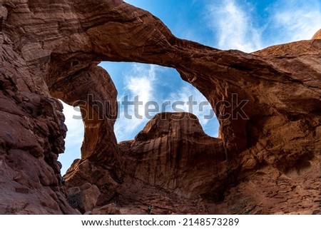 Arches National Park at Midday - Arches has many arches including the famous Delicate Arch, the Window Arch, the Double Arch and other features such as Tower of Babel, Turret Arch, and the Courthouse  Royalty-Free Stock Photo #2148573289