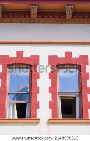Twin Picture Windows with Scarlet Red Trim.