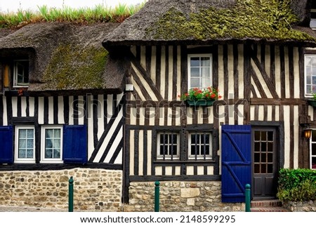 Half timbered, thatched cottage, village of Tourgeville, near Deauville, Calvados, Normandy, France, Europe  Royalty-Free Stock Photo #2148599295