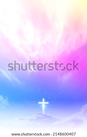 Christian cross appears bright in the sky background and soft clouds. with the light shining as Love. hope and freedom of God Jesus. Royalty-Free Stock Photo #2148600407