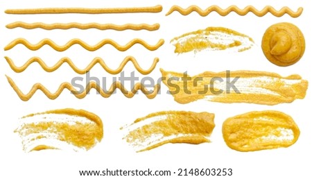 Mustard sauce in the form of lines. Collection of mustard sauce wavy lines isolated on white background. Royalty-Free Stock Photo #2148603253