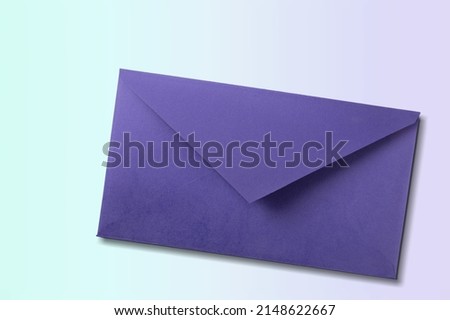 Navy envelope on desk background. Kraft paper with subtle fibers.