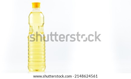 Bottles with natural sunflower oil on a white background. Vegetable oil,Plastic bottle of vegetable cooking oil