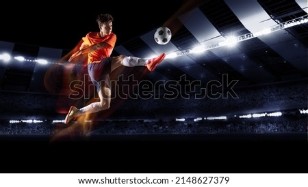 Unstoppable. Collage with young football or soccer player in action on stadium with flashlights, kicking ball for winning goal. Concept of sport, competition, motion, overcoming. Royalty-Free Stock Photo #2148627379