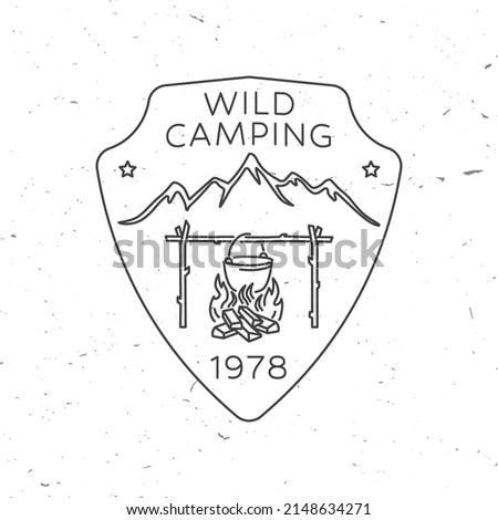 Wild Camping. Vector illustration. Concept for shirt or print, stamp or tee. Vintage line art design with Camper tent, pot on the fire, and mountain silhouette.