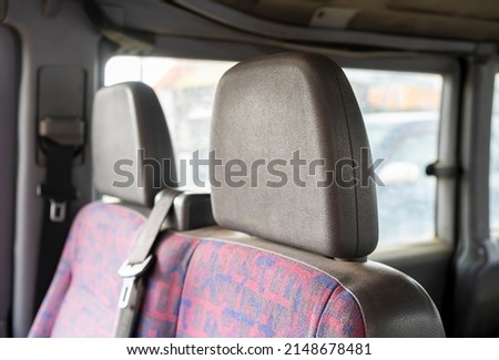 Double passenger seat with headrests.The interior of the minivan. Royalty-Free Stock Photo #2148678481