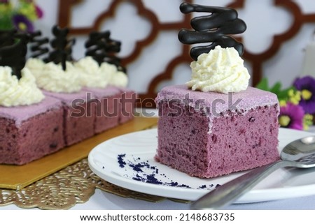 sliced of taro cake on white plate. delicious homemade cake. food photography