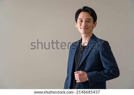 Japanese man in a jacket Royalty-Free Stock Photo #2148685437