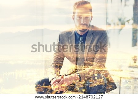 Life in the city. Composite image of a well-dressed man superimposed on an image of a city at night.