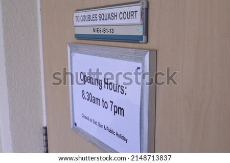The notice about  opening hours of double squash court at NTU   - Singapore - 2012