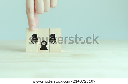 Equality of person concept. Equal employment opportunity. Workload balancing, employee rights. International human rights day. Hiring recruitment. Placing wooden cubes with people equality icon. Royalty-Free Stock Photo #2148725109