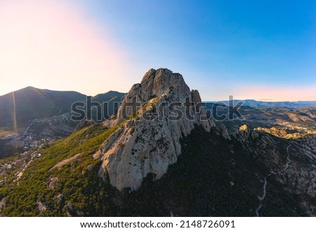 Air tour over the incredible Peña de Bernal on a beautiful sunny day surrounded by nature Royalty-Free Stock Photo #2148726091