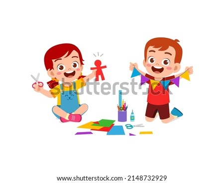 little kid cut paper for art with friend