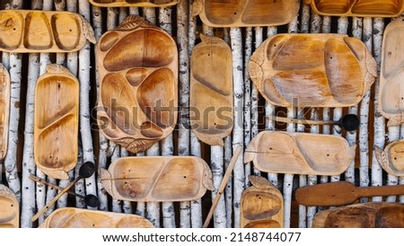 National cuisine background with wooden spoons. plates, trays.