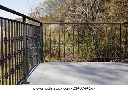 Modern metal railings and handrails in the loft style. The metal is treated with a primer and anti-corrosion paint. Interior design in industrial style. High quality photo Royalty-Free Stock Photo #2148744167