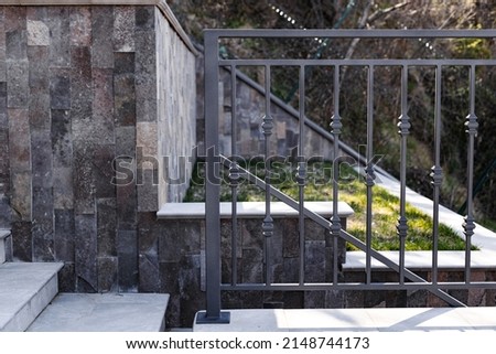Modern metal railings and handrails in the loft style. The metal is treated with a primer and anti-corrosion paint. Interior design in industrial style. High quality photo Royalty-Free Stock Photo #2148744173