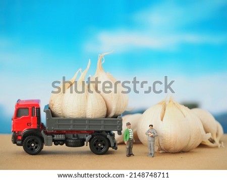 Miniature toys on the brown table with blurred background.