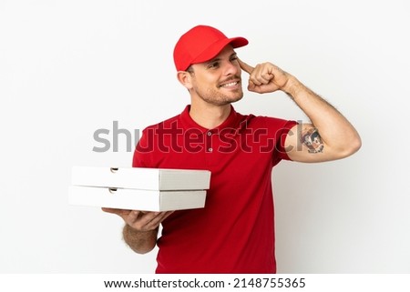 pizza delivery man with work uniform picking up pizza boxes over isolated  white wall having doubts and thinking