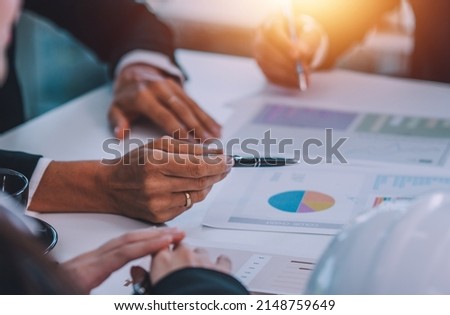 Hand pointing on document report in meeting business marketing Royalty-Free Stock Photo #2148759649