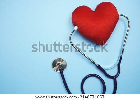 Heart and Stethoscope with space copy on blue background