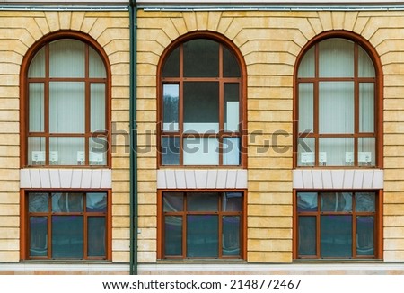 Several windows in a row on the facade of the modern urban apartment building front view, Krasnaya Polyana, Sochi, Krasnodar Krai, Russia Royalty-Free Stock Photo #2148772467