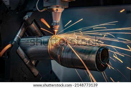 CNC Laser cutting of metal, modern industrial technology Making Industrial Details. The laser optics and CNC (computer numerical control) are used to direct the material or the laser beam generated. Royalty-Free Stock Photo #2148773139