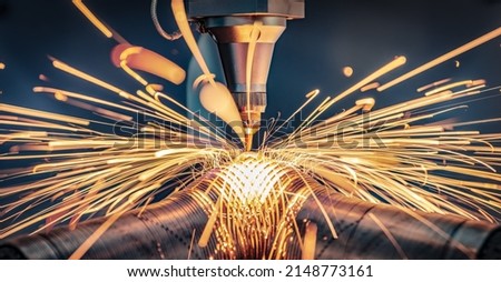 CNC Laser cutting of metal, modern industrial technology Making Industrial Details. The laser optics and CNC (computer numerical control) are used to direct the material or the laser beam generated. Royalty-Free Stock Photo #2148773161
