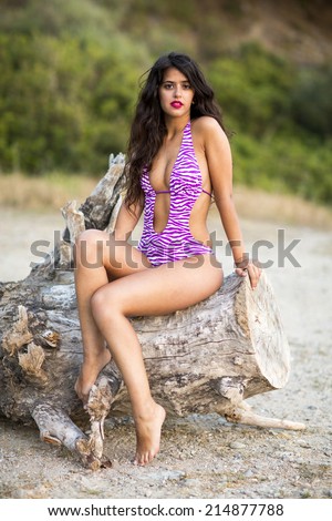 Beautiful woman in bikini on tropical beach