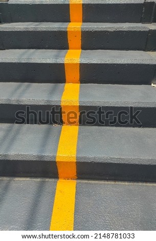 ํYellow straight line on concrete stairs