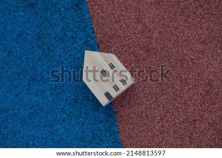 Wooden house toy object on floor background business concept