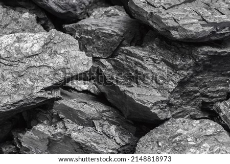 Lumps of black lignite or bituminous coal. Natural source of energy. Mineral stone rock Royalty-Free Stock Photo #2148818973