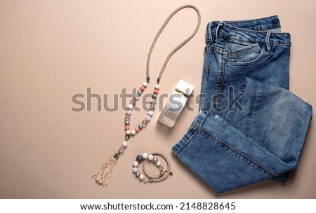 Photography of women's stuff, perfume, jeans, bracelet
