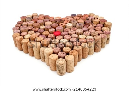 Old Used corks plugs from various types of wine arrange in heart shape