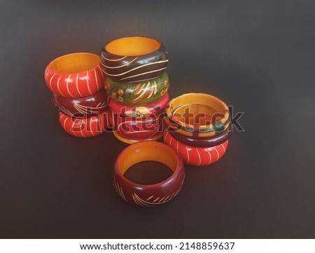 Wooden bangles ethnic jewelry  from India. Channapatna toy town.  Bangles organic colourfully painted. Gift item tourist souvenir .Traditional Handcrafted Colourful bangles bracelet used in fashion. Royalty-Free Stock Photo #2148859637