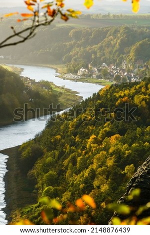 Picturesque autumn sunset scenery of Stadt Wehlen town and Elbe river from Bastei bridge and Sandstone mountains, Saxon Switzerland National Park near Dresden, Germany Royalty-Free Stock Photo #2148876439