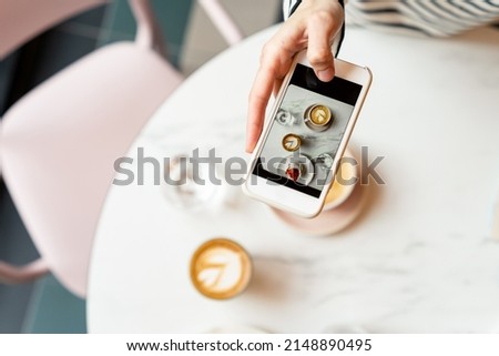 Taking a photo of breakfast with smartphone