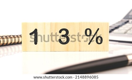 13 Percent a word written on wooden cubes on a white background.