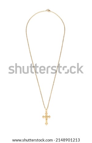 Close-up shot of a gold necklace featuring a cross pendant. The cross is with detailed edge. The fashion necklace features a lobster clasp. The necklace is isolated on a white background. Front view. Royalty-Free Stock Photo #2148901213