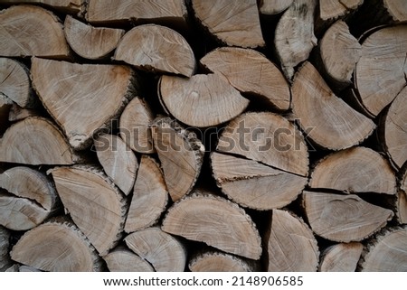 Background with split and stacked firewood