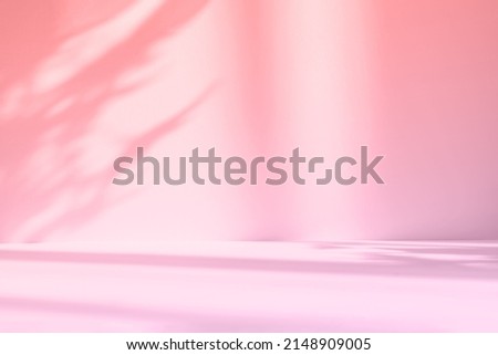 Abstract pink studio background for product presentation. Empty room with shadows of window and flowers and palm leaves . 3d room with copy space. Summer concert. Blurred backdrop. Royalty-Free Stock Photo #2148909005