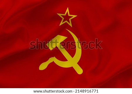 Soviet Union flag on waving silk background. Fabric texture design. Historical flag of USSR. Royalty-Free Stock Photo #2148916771